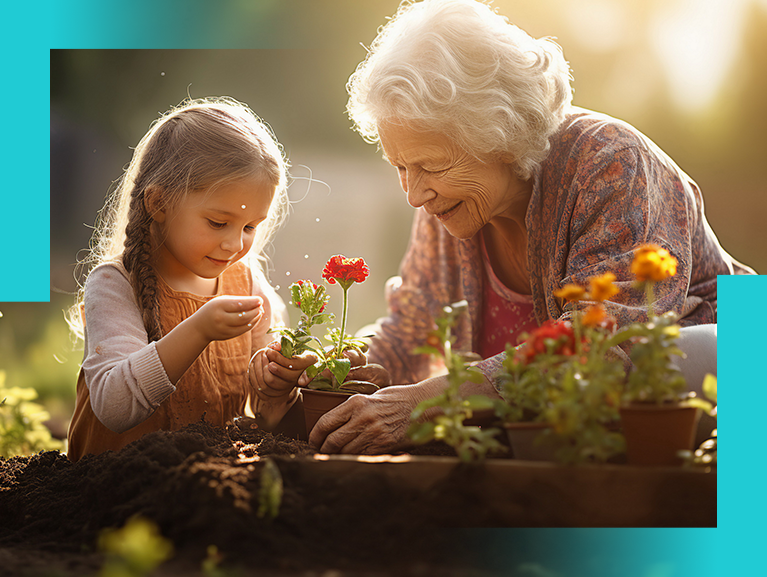 Oma mit Kind pflanzt Blumen